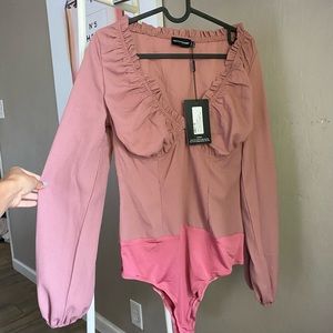 Cute blush bodysuit never worn